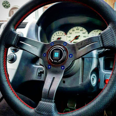 Exoracing burnt titanium style steering wheel bolts fitted to aftermarket steering wheel