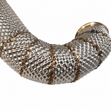 Close-up of overlapping stainless sections and welded seams on a completed custom exhaust heat shield