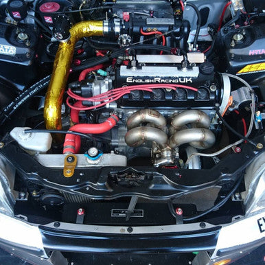 Gold reflective tape installed on performance car airbox
