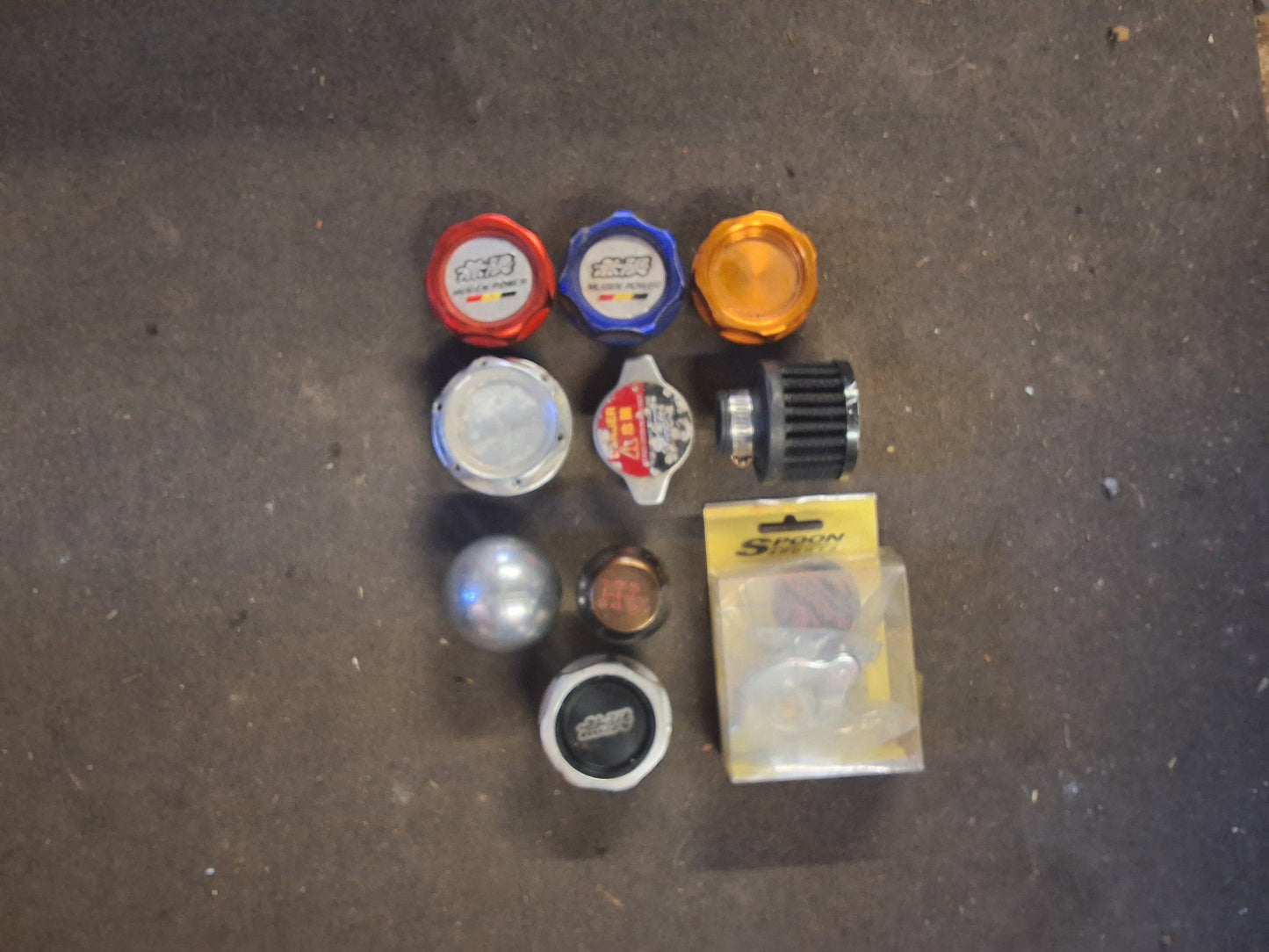 Collection of gear knobs radiator cap and oil caps