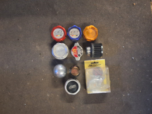 Collection of gear knobs radiator cap and oil caps